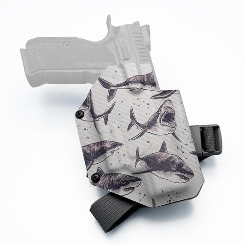 Custom light-bearing OWB KYDEX holster for CZ Shadow 2 with Olight Baldr S, featuring a great white shark carbon fiber pattern and tactical leg strap.