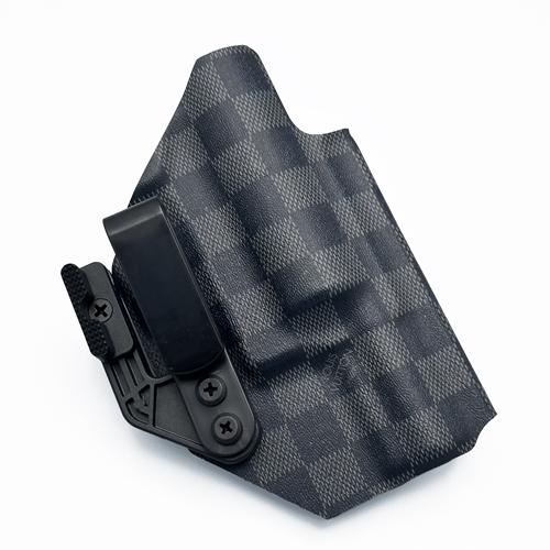 Custom KYDEX j frame holster in LV Damier Graphite pattern, featuring a tacware angled clip and concealment claw for appendix carry.