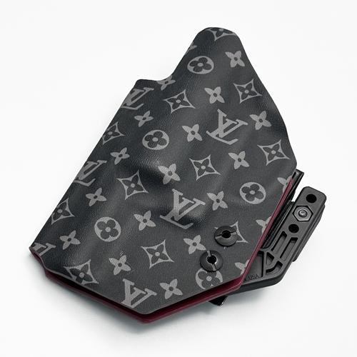Two-tone custom KYDEX j frame holster with LV Eclipse exterior and Blood Red interior lining, featuring a Modwing concealment claw.